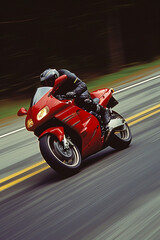 A man is riding a red motorcycle in an inland area that has good road quality.
