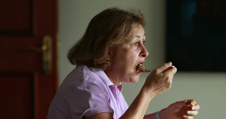 Older woman eating lunch candid authentic