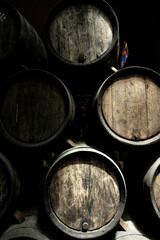Wine casks at the winery. Stacked Wine barrels at the german winery. Old vintage whisky cask. old...