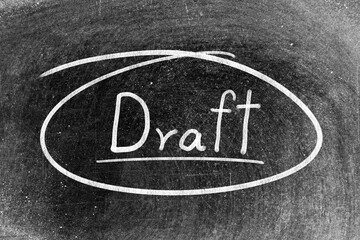 White chalk hand writing in word draft and circle shape on blackboard background