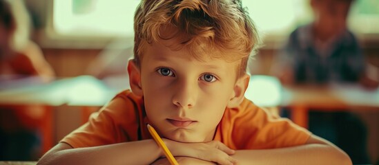 A boy in classroom of primary school with pencil for education concept. AI generated image - obrazy, fototapety, plakaty