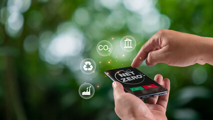 Human using a smartphone to trade carbon credit on application, carbon credit concept, carbon etf...