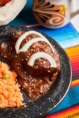 Chicken mole poblano, with chocolate and chilli. Tradition from mexico.
