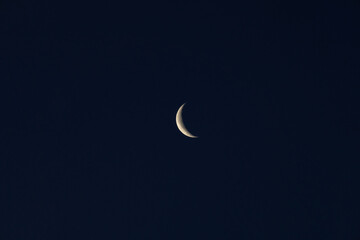 Obraz na płótnie Canvas Crescent Moon on Dusk Sky Twilight After Sundown Religion of Islamic on Ramadan Month, Eid Al Adha, Eid Al Fitr Symbol Photo, Uskudar Istanbul, Turkiye (Turkey)
