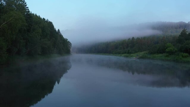 Tranquil scene of calm river with morning haze. Agidel river