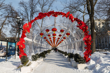 Chinese New Year in Moscow. Decorative tunnel with red decorative lanterns on Tverskoy Boulevard - 731895943