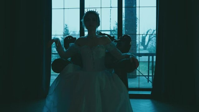 Dark mystical silhouette woman queen sitting on old style throne, medieval lady long dress Gothic crown. royal room window moon light white night. Sexy Princess girl. Evil fairy tale vampire. art 4k