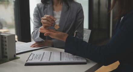 Business Signing a Contract Buy - sell house, insurance agent analyzing about home investment loan Real Estate concept.