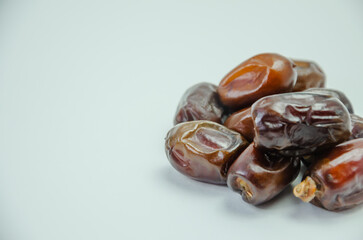 Dried dates on a white background