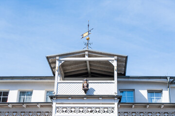 Old white town villa with a admiral figure on the facade on a sunny day in Binz, Rügen, Germany