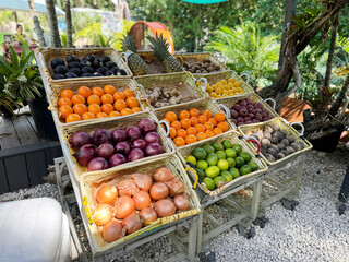 Tropical fruits stand at the farmer's market. Healthy produce
