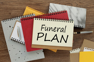 Business concept. Top view, empty notepad and stationery on the table. Funeral Plan