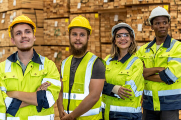 Diversity group of wood factory worker men and woman standing in wood distribution warehouse