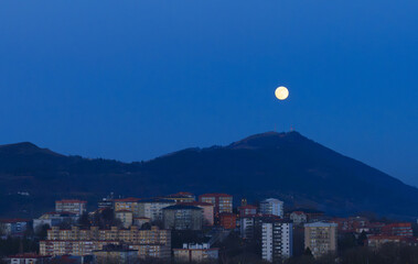 Moonrise. Moonrise over the Jaizkibel mountain and the city of Donostia San Sebastian, Basque Country.