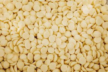 White chocolate small peaces close up photo