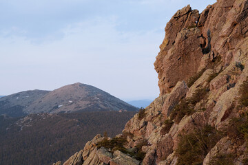 Rocky mountain landscape with a large rock formation that looks like a persons profile