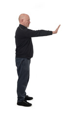 side view of a man showing the stop sign with their hands on white background