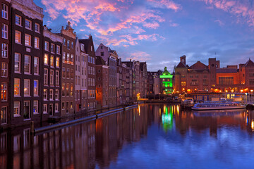 City scenic from Amsterdam by night in the Netherlands at sunset