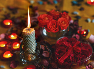Bouquet of roses, candles and gifts, card for February 14, St. Valentine, March 8, wedding, birthday, mother's day, blurred background, bokeh.