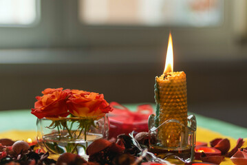 Bouquet of roses, candles and gifts, card for February 14, St. Valentine, March 8, wedding, birthday, mother's day, blurred background, bokeh.