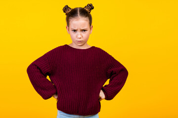 Photo of disappointed unsatisfied girl put hands waist sullen face empty space isolated on yellow color background