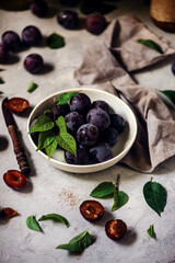 Autumn still life with plums .style rustic