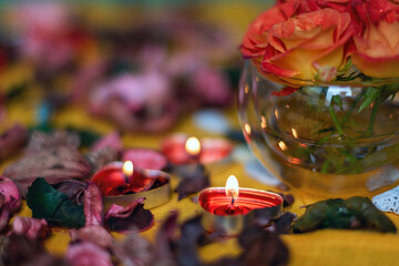 Bouquet of roses, candles and gifts, card for February 14, St. Valentine, March 8, wedding, birthday, mother's day, blurred background, bokeh.