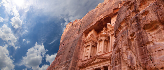 Al Khazneh or The Treasury (against the background of a beautiful sky with clouds). Petra, Jordan--...