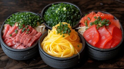 a close up of four bowls of food with noodles and veggies on the top of the bowls and on the bottom of the bowls.
