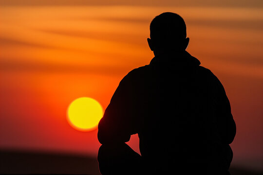 silhouette of a person with sun at 