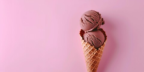 Soft Chocolate Ice Cream in a Waffle Cone on Pink Background, with Copy Space