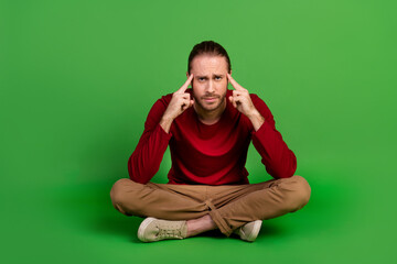 Full length photo of smart clever man dressed red pullover brown pants sitting think business ideas...