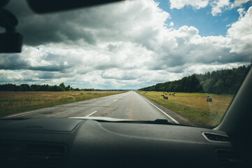 Scenic Countryside Road View from Car, Rural Landscape with Forest. Road Trip and Journey Concept