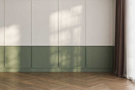 White and green classic wall background, brown parquet floor. Sunlight on wall