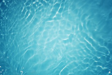 Water surface. Bluewater waves on the surface ripples blurred. Defocus blurred transparent blue colored clear calm water surface texture with splash and bubbles. Water waves with shining pattern.