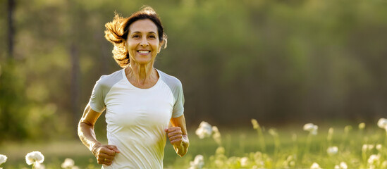 Active Senior Indian Woman Enjoying Morning Jog in Nature. Healthy Aging Concept