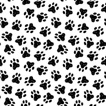 Animal paw seamless pattern. Cat, dog footprint repeat pattern with texture in black and white. Hand drawn paw print background.