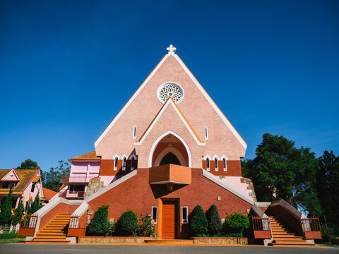 Mai Anh Domaine De Marie Church with vintage windows on brick wall, located in Da Lat, Lam Dong province, Vietnam.