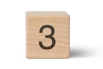 A single wooden block prominently displays a black number three, isolated cutout from background.
