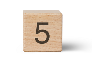 A single wooden block prominently displays a black number five, isolated cutout from background.