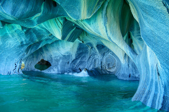 Sculpted blue chapels of  Marble caves or Cuevas de Marmol at turquoise General Cerrerra Lake. Location Puerto Sanchez, Chile