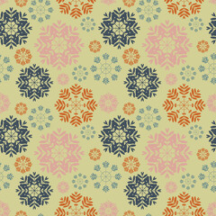 Snowflakes of different colors form a winter seamless pattern for fabrics. 