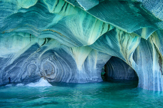 Sculpted blue chapels of  Marble caves or Cuevas de Marmol at turquoise General Cerrerra Lake. Location Puerto Sanchez, Chile