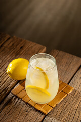 Glass of refreshing lemon homemade drink.