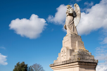 Fototapeta na wymiar winged angel on funeral edicle, Llucmajor cemetery, Mallorca, Balearic Islands, Spain