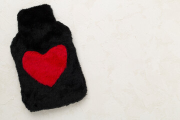 Rubber water warmer bag on concrete background, top view