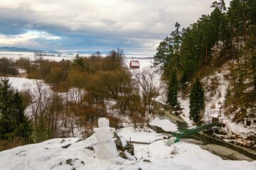 Empty bridge over frozen river Hornad in Slovak paradise. Winter time. Winter trail in Slovak Paradise NP ( SLovensky raj ) with ice, rocks and river.