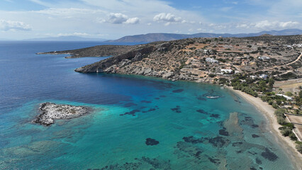 Aerial drone photo of paradise beach of Tsigouri and heart shaped small islet of Plaka, Schoinousa, Small Cyclades, Greece
