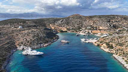 Aerial drone photo of small port of Schoinousa island a safe harbour to yachts and sail boats...