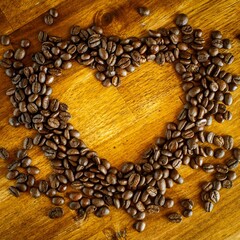 Heart Shape Made From Coffee Beans Wooden Surface